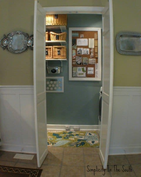 laundry room with cork board that covers the fuse box