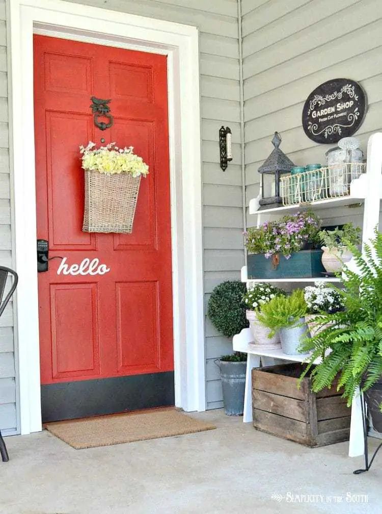 Spring Home Tour 2017- Front porch with red door painted in Sherwin Williams Real Red SW 6868