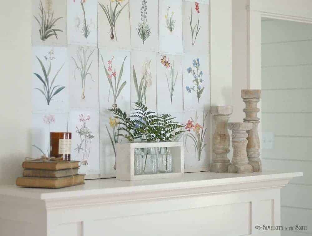 Summer decor for your fireplace mantle can be as simple as using free botanical printables, vases filled with fern leaves, and candle holders.