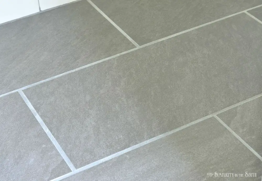 Tile floor in the bathroom that looks like slate but it's porcelain. It can be used in the shower but never needs sealing and has enough texture to keep you from slipping.
