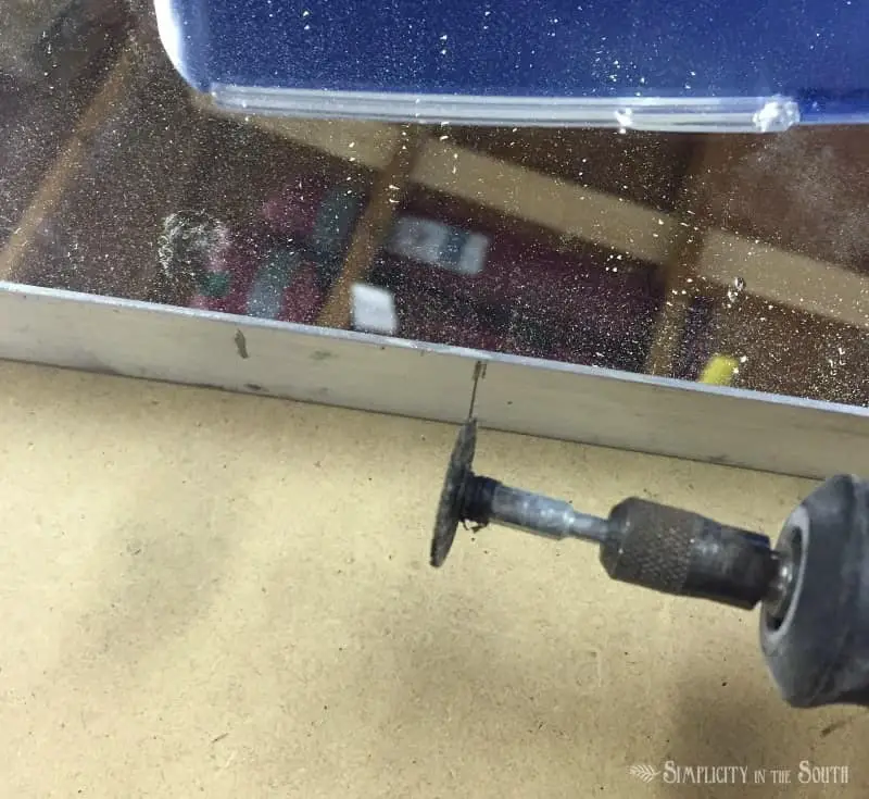 use a Dremel with the cutting blade on the aluminum frame