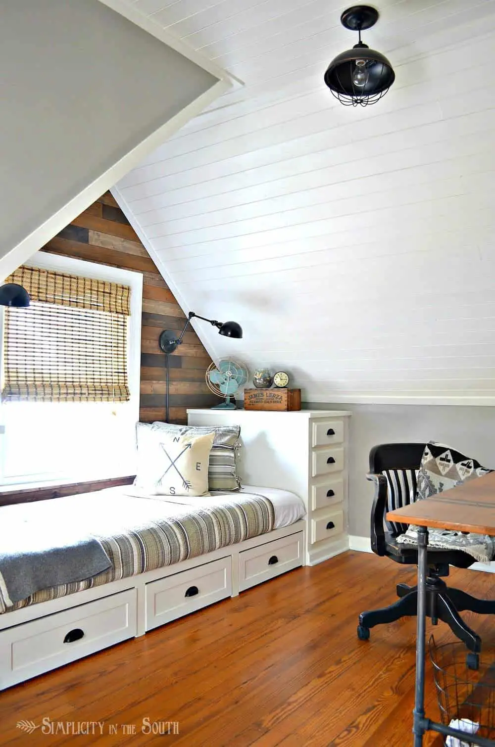 Cozy eclectic dormer bedroom with a built in bed and planked wall and ceilings