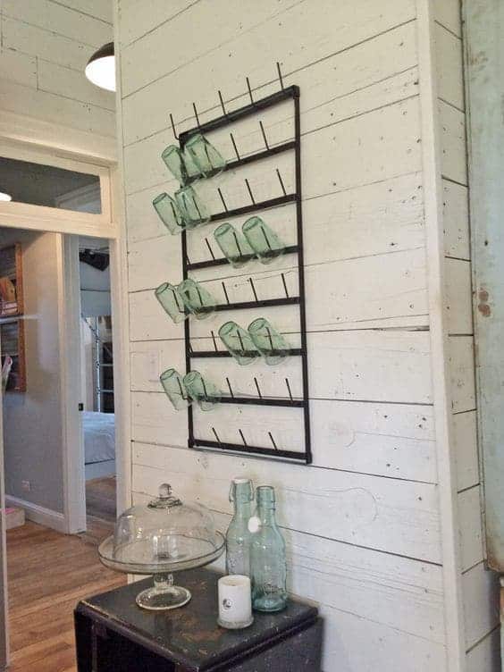 Fixer Upper Magnolia Homes Kitchen with shiplap walls and glassrack beside the island