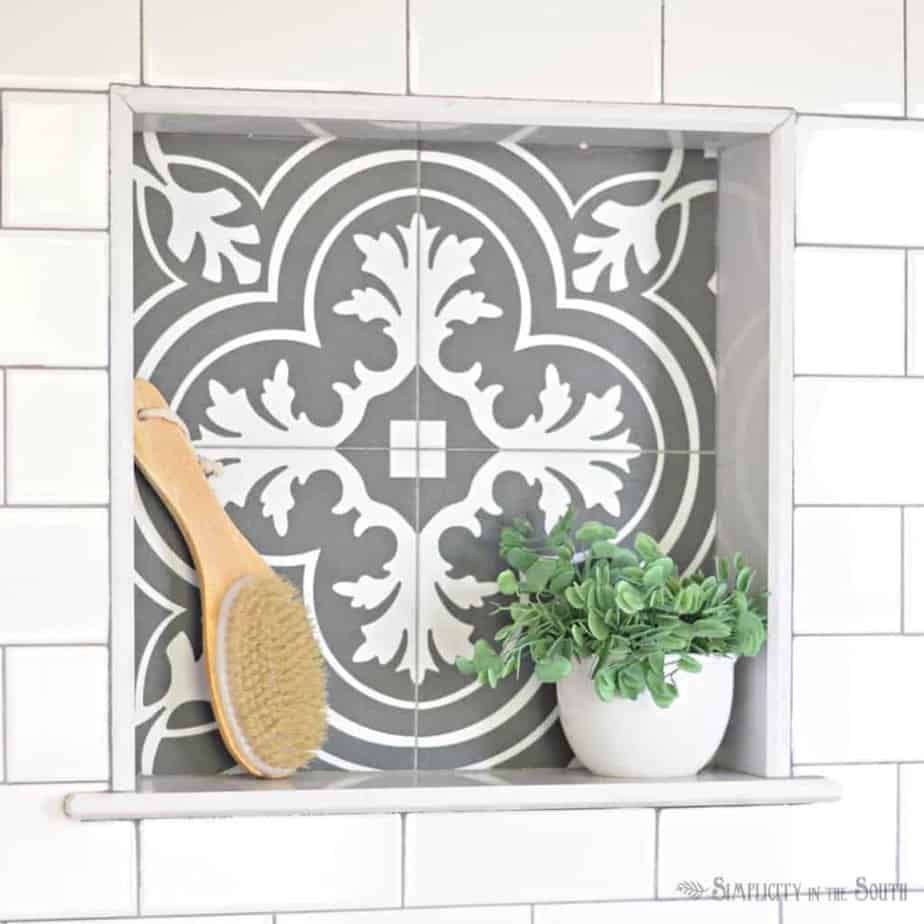 black and white tile inset shower cubby - Merola Twenties tile from Home Depot