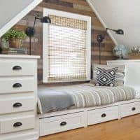 dormer bedroom with built in bed and storage trundle drawers