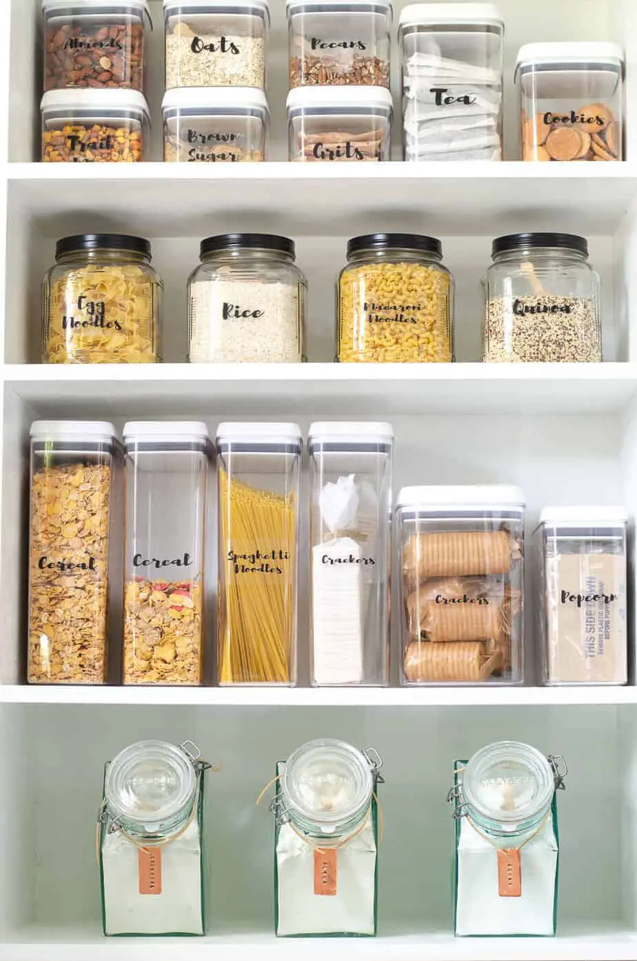 pantry shelving with labeled containers and jars