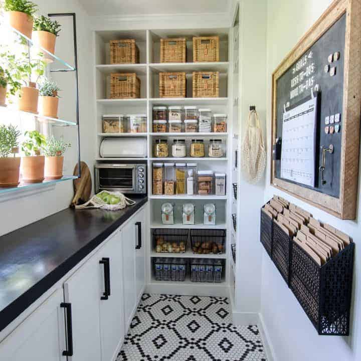 narrow walk in pantry design with countertop and shelving
